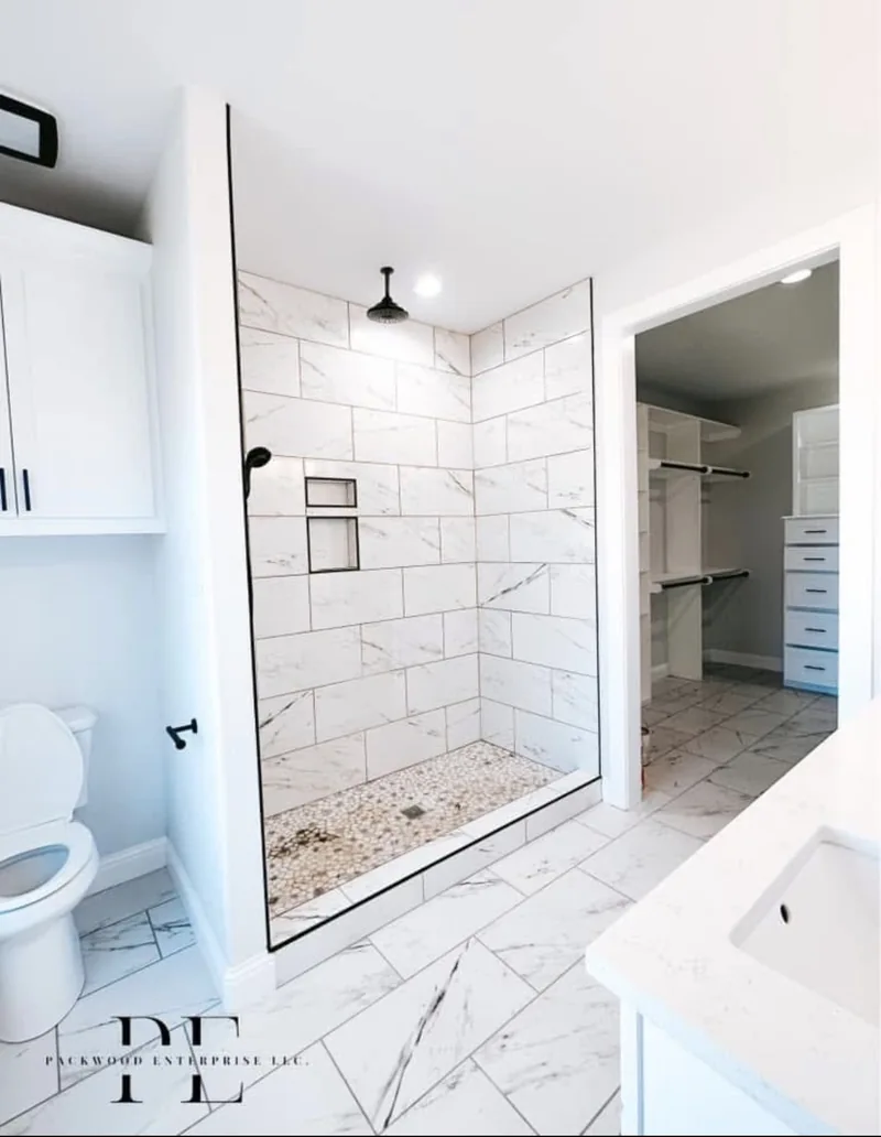 Walk-in tile shower beside a white closet